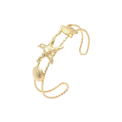 Pulsera Cuff de Stainless Steel con Estrella de Mar, Tortuga y Concha, Dorada