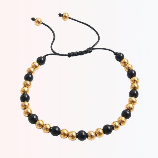 Pulsera Ajustable con Beads Negros y Dorados en Stainless Steel