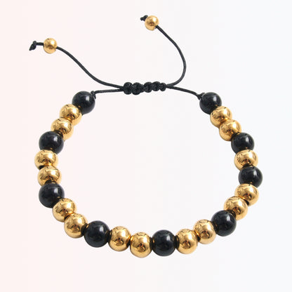 Pulsera Ajustable con Beads Negros y Dorados en Stainless Steel