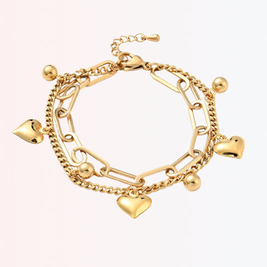 Pulsera Dorada Multicadena con “Charms” de Corazón